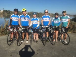 Members of group and friends ride in their IDT jerseys, 2017